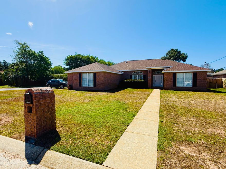 Welcome to this meticulously maintained all-brick, single-story home in the heart of Navarre! Offering 4 spacious bedrooms, 2 full baths, over 2400 sq ft of living space on a corner lot convenient to just about everything.
Step inside to an open floor plan designed for modern living, featuring durable and stylish Pergo flooring throughout the main living areas. The home flows effortlessly from the living room into the dining and kitchen spaces, perfect for both everyday living and entertaining.  Enjoy the gas fireplace, kitchen with stainless steel appliances and ample storage and split bedroom floor plan. The primary suite is a true retreat, showcasing a fully updated bathroom with a stunning tiled shower and frameless glass enclosure, a jacuzzi tub, and elegant quartz double vanities. Outside, enjoy your private fenced backyard complete with a charming pergola-covered patio, firepit area, mature trees and shed--ideal for outdoor dining, relaxing, or hosting gatherings. The oversized side-entry garage offers plenty of space for vehicles and storage. The corner lot makes accessing the single and double gates to the backyard a breeze. Located in a highly desirable area, this home is just minutes from town and within walking distance to the local high school and YMCA. Best of all--no HOA means more freedom and fewer restrictions.  You'll enjoy peace of mind with the new roof and water heater in 2024, a 4 ton Trane gas HVAC and hurricane rated garage door with fabric shields for all the windows.  This move-in-ready home checks all the boxes--don't miss your opportunity to make it yours! Professional photos coming soon!