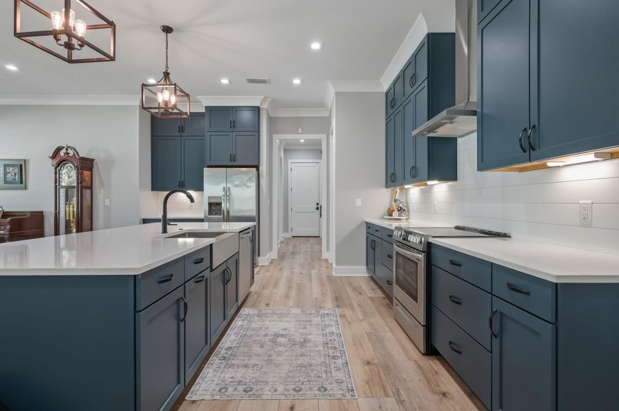 Seller offering $10,000 toward buyer closing costs or rate buy-down!
Welcome to this beautifully designed 4 bedroom, 3 bathroom home in Deer Moss Creek, Niceville, FL, offering the perfect blend of modern finishes and timeless Southern charm. Located at 405 Sweetgrass Lane, this 2,546 sq ft home features a bright, open-concept floor plan ideal for both everyday living and entertaining.
Step inside through oversized double glass doors into a light-filled living space with luxury vinyl plank flooring throughout. The living room showcases an electric fireplace and designer accent wall, creating a warm and inviting focal point. The seamless flow continues into the dining area and spacious kitchen. Seller offering $10,000 toward buyer closing costs or rate buy-down!

Welcome to this beautifully designed 4 bedroom, 3 bathroom home in Deer Moss Creek, Niceville, FL, offering the perfect blend of modern finishes and timeless Southern charm. Located at 405 Sweetgrass Lane, this 2,546 sq ft home features a bright, open-concept floor plan ideal for both everyday living and entertaining.

Step inside through oversized double glass doors into a light-filled living space with luxury vinyl plank flooring throughout. The living room showcases an electric fireplace and designer accent wall, creating a warm and inviting focal point. The seamless flow continues into the dining area and spacious kitchen.

The kitchen is designed for gathering, featuring an oversized island with seating, quartz countertops, ceiling-height cabinetry with crown molding, and a walk-in pantry with custom wood shelving--perfect for both storage and style.

The primary suite offers a private retreat with elegant ceiling details, a custom accent wall, and a spa-like bathroom complete with a soaking tub, glass-enclosed tile shower, private water closet, and walk-in closet with built-in shelving.

Additional bedrooms provide flexible living options, including a guest suite with a private en-suite bath and two bedrooms connected by a Jack-and-Jill bathroom, ideal for a variety of living arrangements.

Upgrades throughout the home include plantation shutters and impact-rated windows, combining style with durability. The low-maintenance exterior features permanent outdoor lighting, adding year-round curb appeal and convenience. A 2-car garage completes the home.

Located in the highly sought-after Deer Moss Creek community, residents enjoy amenities including a resort-style pool, clubhouse, walking trails, parks, gazebo, and recreational spaces. Convenient to Eglin Air Force Base, Hurlburt Field, local dining, shopping, and Emerald Coast beaches.

This move-in ready home offers the space, style, and location today's buyers are searching for--schedule your showing today.