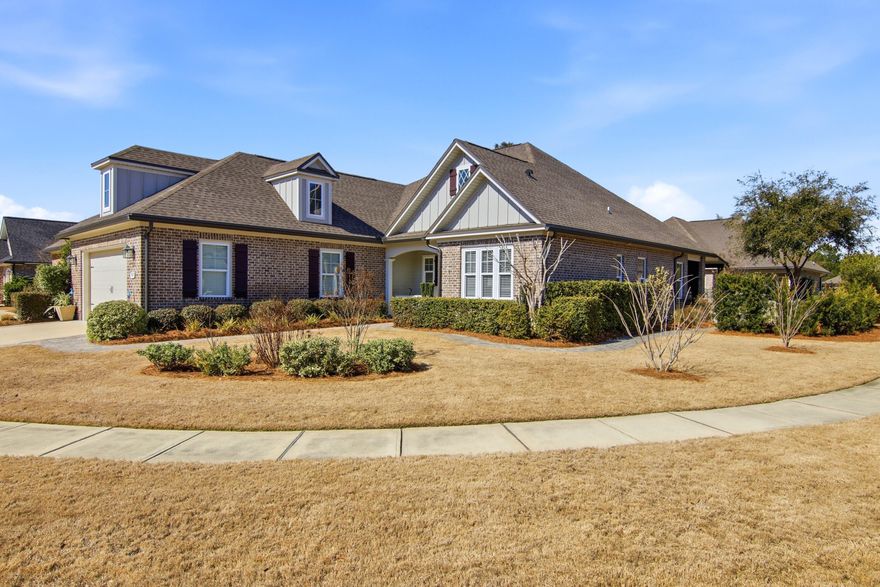 Welcome to this beautifully maintained home in the highly sought-after Hammock Bay community, where thoughtful upgrades and quality craftsmanship shine throughout. Now priced $35,000 below recently appraised value. Painted in a soft, light gray palette, the interior offers a timeless backdrop ready to complement any style. Step inside to find durable and stylish LVP flooring flowing through the main living areas, with elegant porcelain tile in the bathrooms for easy upkeep. Crown molding adds a refined touch throughout, while subtle shiplap detail in a transition space brings warmth and character. Ceiling fans in the living room, all bedrooms, and the flex room provide year-round comfort. The open-concept living space is designed for both everyday living and effortless entertaining. The spacious living room connects seamlessly to a stunning kitchen featuring quartz countertops, stainless steel appliances, a custom backsplash, and an oversized island with generous seating and serving space; truly the heart of the home. This thoughtfully designed floor plan offers three large bedrooms plus a versatile flex room, making it ideal for a fourth bedroom, guest space, or home office. The bathrooms echo the kitchen's upscale finishes with matching quartz surfaces for a cohesive, elevated feel. A spacious laundry room conveniently connects to the finished two-car garage. Situated on a desirable corner lot, the home's curb appeal immediately stands out.  A custom-designed paver patio creates a seamless transition from the front entry to the backyard, gently winding through lush garden beds and offering a charming outdoor passageway from the covered front porch around to the screened in back patio. Rain gutters surround the home, and the beautifully landscaped yard is complemented by a fully fenced backyard, providing privacy for relaxing evenings or hosting friends and family. Built by Randy Wise and spotlessly maintained, this move-in-ready home blends comfort, style, and exceptional outdoor living; all in one of Hammock Bay's most charming neighborhoods. Consider this your official invitation to experience what the Hammock Bay lifestyle is all about and schedule your showing today!