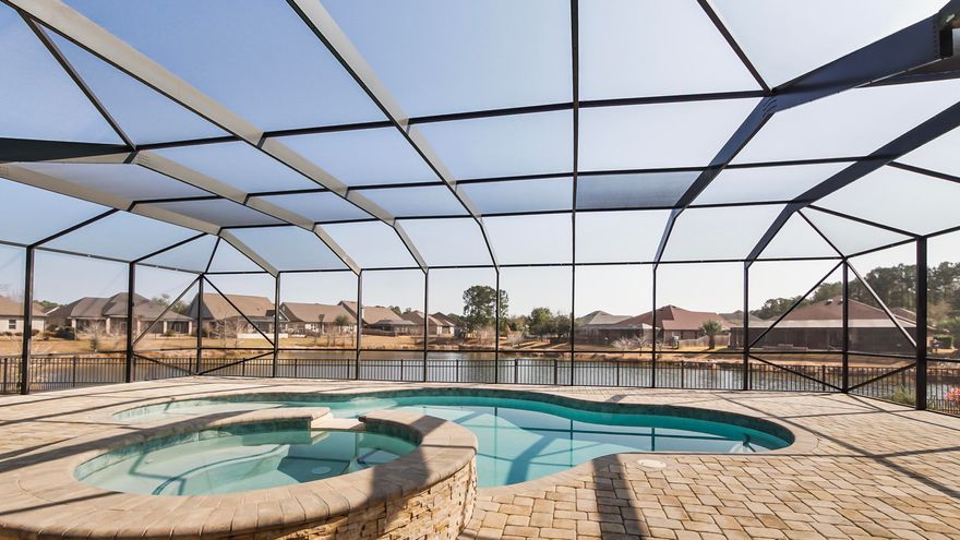 Overlooking a pristine lake in The Meadows at Hammock Bay, this exceptional Randy Wise built home offers a true backyard retreat. The ozone pool and spa create a private oasis perfect for relaxing evenings or entertaining against a stunning waterfront backdrop. Upgraded landscaping enhances the beauty and privacy of this premier lakefront lot. Inside, the open-concept design seamlessly connects the main living areas, creating an ideal space for everyday living and gatherings. The gourmet kitchen features Frigidaire Professional Series appliances, a gas cooktop, built-in wall oven, granite countertops, and a custom walk-in pantry. The primary suite is a peaceful haven with a spa-like bath and expansive custom closet system. Additional highlights include custom built-ins, epoxy-coated garage floors, heavy-duty shelving, and fresh interior paint throughout.  Lakefront luxury living at its finest.  

Living in Hammock Bay is more than owning a home, it's embracing a lifestyle.  From resort-style pools and a state-of-the-art fitness center to tennis courts, sports fields, parks, playgrounds, and miles of walking and biking trails, Hammock Bay was thoughtfully designed for connection, activity, and everyday enjoyment. The community clubhouse serves as a central gathering space, and year-round events bring neighbors together in a way that truly sets this neighborhood apart.  Whether it's morning workouts, afternoon bike rides, evenings by the pool, or community celebrations with friends, Hammock Bay offers something for every stage of life.