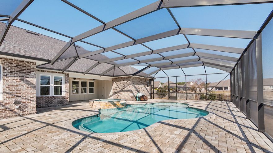 Overlooking a pristine lake in The Meadows at Hammock Bay, this exceptional Randy Wise built home offers a true backyard retreat. The ozone pool and spa create a private oasis perfect for relaxing evenings or entertaining against a stunning waterfront backdrop. Upgraded landscaping enhances the beauty and privacy of this premier lakefront lot. Inside, the open-concept design seamlessly connects the main living areas, creating an ideal space for everyday living and gatherings. The gourmet kitchen features Frigidaire Professional Series appliances, a gas cooktop, built-in wall oven, granite countertops, and a custom walk-in pantry. The primary suite is a peaceful haven with a spa-like bath and expansive custom closet system. Additional highlights include custom built-ins, epoxy-coated garage floors, heavy-duty shelving, and fresh interior paint throughout.  Lakefront luxury living at its finest.  

Living in Hammock Bay is more than owning a home, it's embracing a lifestyle.  From resort-style pools and a state-of-the-art fitness center to tennis courts, sports fields, parks, playgrounds, and miles of walking and biking trails, Hammock Bay was thoughtfully designed for connection, activity, and everyday enjoyment. The community clubhouse serves as a central gathering space, and year-round events bring neighbors together in a way that truly sets this neighborhood apart.  Whether it's morning workouts, afternoon bike rides, evenings by the pool, or community celebrations with friends, Hammock Bay offers something for every stage of life.