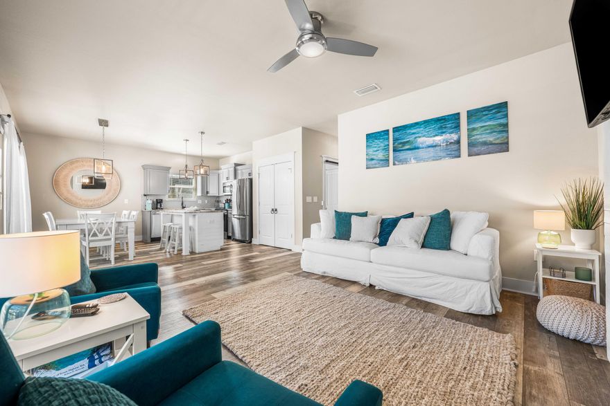 A rare opportunity to step seamlessly into the Santa Rosa Beach lifestyle, this three-bedroom, two-bathroom bungalow offers the flexibility today's buyers crave. Already established as a successful vacation rental with proven income history, it also lives beautifully as a full-time residence or second home near the coast. Built in 2020 and thoughtfully finished from exterior to interior, the home welcomes you with generous double parking and a wide staircase leading to a spacious front porch complete with a custom swing -- the kind of spot made for slow mornings and evening breezes. Inside, soft neutral tones and wide-plank LVP flooring create a relaxed coastal aesthetic throughout the open living, dining and kitchen areas. Granite countertops, coastal gray cabinetry and an attractive backsplash frame a kitchen designed for both everyday living and entertaining. A built-in electric fireplace anchors the main living space with warmth and character while natural light fills the interior. A custom barn door conceals the oversized laundry area and leads to a convenient side exit, keeping daily life practical and organized. Both bathrooms feature beautifully tiled showers that add a polished touch. Out back, the scale is a true standout. The oversized fenced yard offers ample room for gatherings, pets and play -- even future pool plans -- with a spacious deck, pavered walkway and firepit creating an inviting outdoor setting. Whether hosting friends after a beach day or unwinding beneath the stars, this backyard was built for real outdoor living. With no HOA restrictions, flexibility is built in. Public beach access at Ed Walline Regional Beach Access and Blue Mountain Beach is just minutes away, along with 30A dining and shopping. Boating enthusiasts will appreciate being just five minutes from Cessna Landing Boat Ramp, which offers easy access to the bay and open water. For those seeking a smart investment, a great starter home or a coastal retreat with room to grow, this property offers space, style and location in equal measure.