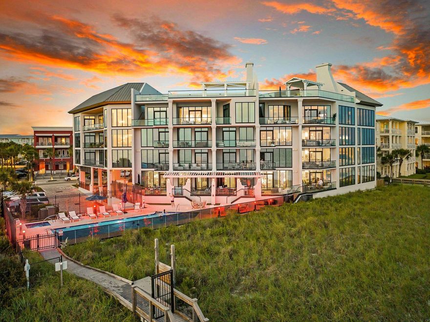 Perched atop Costa Blanca, one of the most exclusive condominium communities along Scenic Highway 30A, Penthouse 400 offers a front row seat to some of the most spectacular views on the Emerald Coast. With only 14 residences and a rental-restricted ownership structure, Costa Blanca offers a private beachfront lifestyle that is increasingly difficult to find along 30A. One of just three penthouse residences in the building, Penthouse 400 presents a rare opportunity to own within this boutique Gulf-front community. From the moment you step inside, the contemporary architecture takes center stage. Cypress ceiling accents in the entryway and kitchen add warmth and texture to the clean, modern design, while statement chandeliers in the foyer and above the dining area create an elegant first impression. Floor-to-ceiling glass fills the living spaces with natural light and frames panoramic views stretching from the emerald waters of the Gulf to the vibrant energy of Gulf Place and the Scenic 30A coastline beyond. The perspective from the main living area is truly unique, creating the feeling of being suspended above the water. Spanning more than 2,800 square feet, this four-bedroom, four-bath penthouse was designed to maximize both privacy and views. Each bedroom features floor-to-ceiling glass and a private ensuite bath, creating a luxurious retreat for owners and guests alike. Three of the four bedrooms also offer direct balcony access, seamlessly connecting indoor and outdoor living. Recent designer updates enhance the residence throughout, blending contemporary style with timeless coastal elegance. The open-concept floor plan effortlessly connects the kitchen, dining, and living areas, creating an inviting space for entertaining or everyday living. Premium finishes include driftwood-inspired tile flooring, quartz countertops, custom cabinetry, and a chef's kitchen equipped with Wolf and Sub-Zero appliances. Offered fully furnished, Penthouse 400 is truly turnkey and ready to be enjoyed from day one. Two assigned garage parking spaces, ideally positioned near the elevator, and a private storage unit add convenience to luxury living. Residents of Costa Blanca enjoy a gulf-front pool and spa, fitness center, more than 200 feet of private beach frontage, including seasonal chair and umbrella service. Perhaps the most appealing feature of all is the location. Just across the street, Gulf Place offers the walkable 30A lifestyle buyers seek, with restaurants, boutiques, coffee shops, live music, green spaces, and family-friendly events right outside your door. Whether you're watching sunsets over the Gulf, taking in the coastline views from your balcony, or enjoying an evening stroll to dinner, Penthouse 400 delivers a rare combination of privacy, contemporary design, and beachfront living in the heart of 30A.