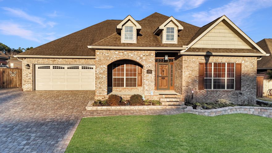Welcome to your own castle retreat south of I-10 in a peaceful edge of town. This impressive 3,457 square-foot home offers the perfect blend of space, character and comfort all nestled in a quiet, established neighborhood where you can truly unwind. As you pull in to the driveway you'll immediately notice the beautiful paver stones and paver stone planters adding charm and curb appeal. Walking in you are welcomed by a warm versatile area to use as a perfect spot as either a dining room, to greet guests or create a cozy reading nook. The possibilities are endless. The home carries an elegance, giving it a grand yet inviting feel from the moment you enter. First on your right the office makes a statement of its own with stunning custom solid wood arched-style doors that add character. and sophistication! Great space whether you work from home, homeschool, or just need quiet.
This room offers privacy and charm you won't find just anywhere. 

The heart of the home is the open-concept kitchen and living room designed for connection and entertaining. The spacious kitchen features a large island perfect for morning coffee or gathering with friends and family. From the kitchen, you can overlook the living area, making it easy to stay part of every conversation. Imagine cozy evenings by the real fireplace, holiday gatherings, and everyday moments. 
One of the true highlights is the beautiful oversized Florida room filled with natural light coming through the sliding glass/screened windows that catch all the sun and daily breezes.  It also boasts an easy-to-maintain epoxy floor. 
Out back, you will find even more to love: a large storage shed with electric running to it and two lofts for extra space to store tools or seasonal decor, keeping everything organized and out of sight. 
There's also a private small basketball court area perfect for friendly games or just practicing shots. Create fun memories in your own backyard, whether it's playing after school or just enjoying the outdoors. Come experience it for yourself and imagine the life you could build here.

Florida room windows have a 20-year transferable warranty from the date of installation that can be passed onto the new buyer says the seller. Check out the attached documents of upgrades: New A/C (2023), new roof will be installed prior to closing (2026). New carpets installed (2018), and steam cleaned every year for perfect maintenance. Pet-free home. Extra insulation added to the home for more energy efficiency and to save you money! Home generator installed (2023) for protection from power outages. All blinds updated (2019) for a more consistent decor. New Hot water tank (2025) Seller is providing a 1 year Assurant Home Warranty so you can feel confident in this quality home!