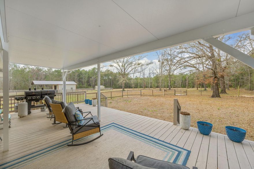 Welcome home to peaceful country living just minutes from everything you love! Located less than two miles from both beautiful Lake DeFuniak and the charming shops and restaurants of Downtown DeFuniak Springs, this brick home offers the perfect blend of privacy, space, and convenience.
Situated on 2.5 acres of manicured land, the property immediately impresses with its brand-new covered back deck overlooking your expansive backyard. The fenced-in yard features raised garden beds ready for planting The large enclosed barn provides excellent storage and workshop potential. The lean-to  provides covered parking for equipment and recreational vehicles.
Inside, you'll find 4 bedrooms and 1 beautifully renovated bathroom, completely updated from top to bottom with modern finishes. The spacious kitchen offers abundant cabinet storage and flows seamlessly into a dedicated dining area and living room--perfect for everyday living or entertaining.
The fourth room adds valuable flexible space and can serve as a fourth bedroom, home office, hobby room, or additional storage area. The oversized primary bedroom provides plenty of room for a cozy sitting area or workspace and includes a generous walk-in closet.
Additional highlights include a durable metal roof that's only 12 years old, offering peace of mind for years to come. The interior of the home has also been completely repainted.