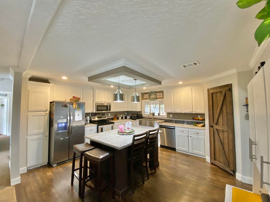 REDUCED! Immaculate 4B 2BA home in beautiful Juniper Lake Estates with Lake access. A 1-acre parcel mostly cleared with space to breathe. Have your own fresh vegetable gardens, chickens and pen convey. A new 20x20 garage/shop is on the property with a 8x18 lean-to houses toys, lawn equipment etc. Also newer is a Huge covered deck built sturdily (metal rafters) almost the length of the back of the home 50x14 with 2x6 decking.
Once inside experience over 2,200 sq. ft. of spacious living with a split floor plan, spacious formal living room, dining room, family room with fireplace and large well-equipped kitchen. Kitchen has a breakfast bar/island, stainless appliances, stainless butcher sink with ample cabinet space. Mud room/laundry room headed to the covered back deck. 
 Plenty of parking space for an RV, boats, family cars. Come see this one today at this price it won't last long. Buyer and Buyers agent to verify all dimensions and anything deemed important. Survey and Addenda in Documents.