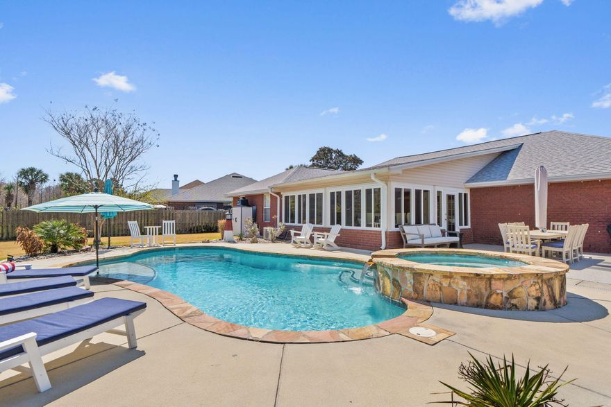 Welcome to this beautifully updated 4-bedroom, 2-bath pool home offering a spacious open floor plan designed for both everyday living & entertaining. The large kitchen is the heart of the home, featuring granite countertops, new appliances, a breakfast bar, and an expansive kitchen nook, plus a separate formal dining area for gatherings & special occasions. This thoughtfully designed split floor plan provides privacy for the oversized primary suite, which includes two walk-in closets, a luxurious jetted soaking tub, walk-in shower, and a private door leading directly to the sunroom -- the perfect retreat for morning coffee or evening relaxation. Fresh interior paint and modern updates throughout make this home truly move-in ready. Step outside to enjoy the sparkling pool & outdoor living at its finest!