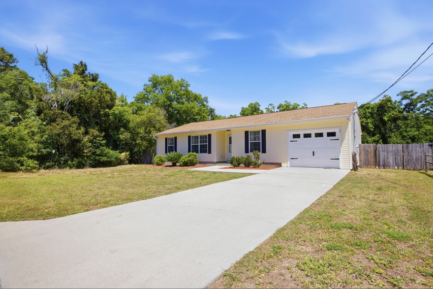 All the upgrades you want at an affordable price. This 3 bedroom, 2 bath home includes a dedicated office space and has already seen major improvements: a new roof (2021), HVAC system (2019), and water heater (2020).
Ideally located near downtown Fort Walton Beach, you'll enjoy convenient access to shopping, dining, and are just minutes from the sugar white beaches of Okaloosa Island and Destin.
Inside, the home features high vaulted ceilings and a striking built-in shiplap accent wall complete with cabinetry and an electric fireplace. A versatile bonus room with its own exterior entrance to the backyard offers endless possibilities, perfect for a home office, playroom, or hobby space. Ceiling fans throughout for added comfort. The kitchen features quartz countertops, stainless steel appliances, a single-basin sink, gold hardware and faucet, and a pantry closet.

Split floor plan with a private primary suite, including a walk-in closet with custom shelving and a bathroom with a stand-alone shower.

Backyard includes a painted deck, privacy fencing, built-in firepit with rock surround, and paved patio areas on both sides of the deck. Double gate with concrete pad offers RV or boat parking.

Presented with staging furniture.