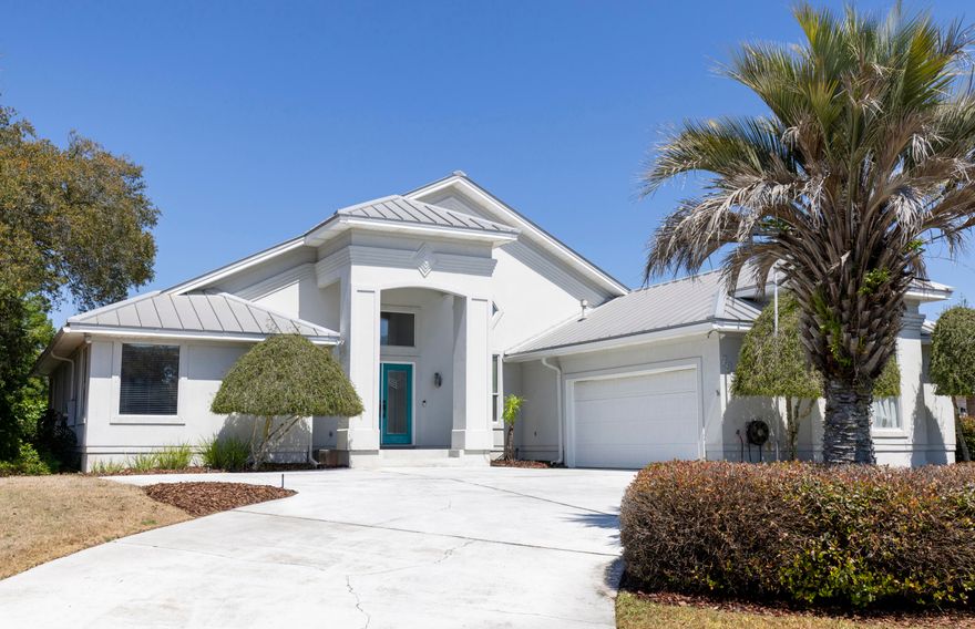 One-owner waterfront home located in the desirable Lake Pointe subdivision, perfectly positioned on Lake Lorraine with direct access to Choctawhatchee Bay and just minutes from Crab Island. This spacious 5 bed/3-bath home offers an open-concept design filled with natural light, highlighted by vaulted ceilings and expansive windows that showcase beautiful water views.  The main living area features multiple doors leading out to a large deck, ideal for indoor-outdoor living and entertaining. The kitchen is open and inviting with a center island, gas cooktop, breakfast bar, a pantry and ample counter and cabinet space.  The main-level Master Suite includes a well-appointed ensuite bath with double vanities, tile flooring, walk-in shower, and a garden tub, along with generous closet space. An additional bedroom and full bath are also located on the main floor.  Downstairs, you'll find three additional bedrooms and a full bath, providing plenty of space for family or guests.  From here, step outside to enjoy the enclosed in-ground pool and hot tub, along with a private pathway leading to the boat dock complete with lift--perfect for enjoying waterfront living at its finest