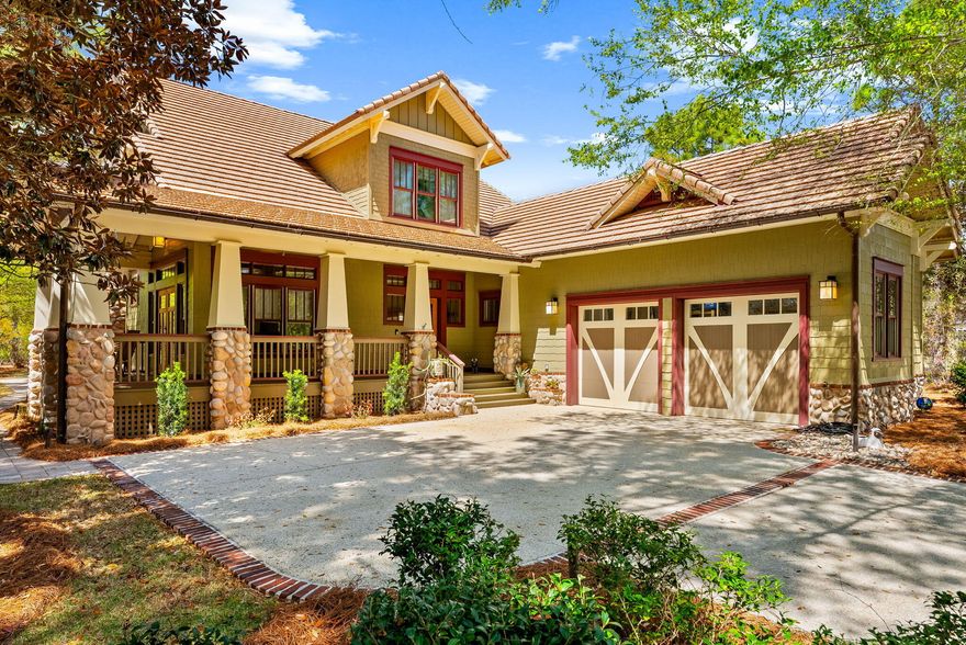 A rare find, offering a boat-slip opportunity with an acceptable offer. 1613 Meadow Lark Way is tucked within the gated community of Wild Heron and positioned along the 4th hole of the Sharks Tooth Golf Course, this thoughtfully designed custom home offers timeless craftsmanship, privacy, and an exceptional setting. From the moment you arrive, the inviting front porch and natural stone accents set the tone for what's inside. The home features rich woodwork throughout, including custom trim, doors, and cabinetry, creating a warm yet refined feel. The main living area is anchored by a fireplace and framed by abundant natural light, while the open-concept kitchen offers granite countertops, gas range, and generous bar seating ideal for both everyday living and entertaining. The spacious  layout includes multiple living areas, a dedicated dining space, and a flex room perfect for a home office or sitting area. Large windows and French doors connect the indoor living spaces to the outdoor porches, allowing you to enjoy the peaceful, golf course surroundings. Situated on a private homesite along the 4th fairway, this property offers a rare combination of tranquility and convenience. Wild Heron residents enjoy access to resort-style amenities including a pool, fitness center, waterfront dock on Lake Powell, , and walking trails just moments from the Gulf's white sand beaches. A true opportunity to own a well-crafted home in one of Panama City Beach's most sought-after gated communities.