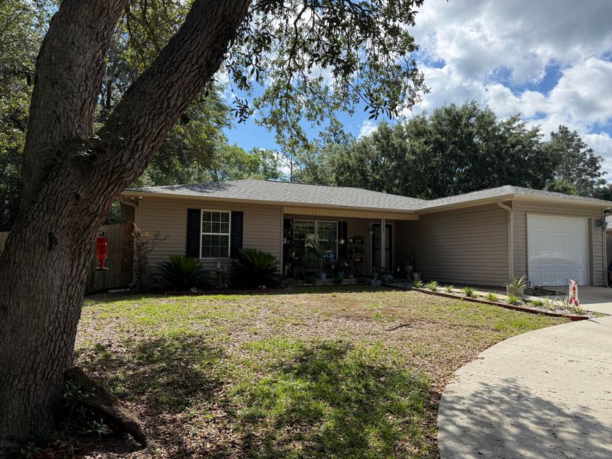 Peaceful setting near NAS Whiting Field on a spacious .36 acre lot.  This 3-bedroom 2-bathroom home offers a split floor plan with an open design that connects the kitchen, breakfast nook, and living room.  The kitchen is fully equipped and is open to the dining space, making it practical for everyday use and entertaining.  The split bedroom floor plan offers privacy, and each bedroom features a walk-in closet.  The fully fenced backyard gives you plenty of options for gardening, games, grilling, or just relaxing.  Prewired security cameras will convey.  A new roof was installed in 2022.