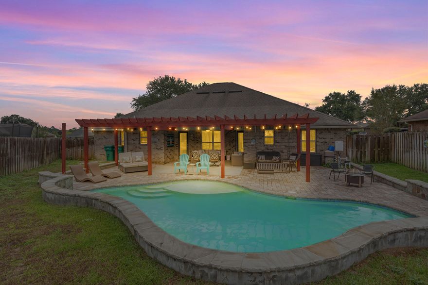 Welcome to Chanan Estates, one of Crestview's most sought-after gated communities! This beautiful 4-bedroom plus a bonus room home combines an open-concept layout with thoughtful updates inside and out. The most notable update includes a sparkling gunite pool added in 2020.

Inside, the main living area features stylish shiplap accents, abundant natural light, and a seamless flow into the dining space and kitchen. The layout is perfect for entertaining or everyday life. The kitchen is fully equipped with stainless steel appliances and all of the cabinet space you could ever want. The first floor includes a spacious primary suite that offers a true retreat with double vanities, double closets, a soaking tub, and a fully tiled shower.