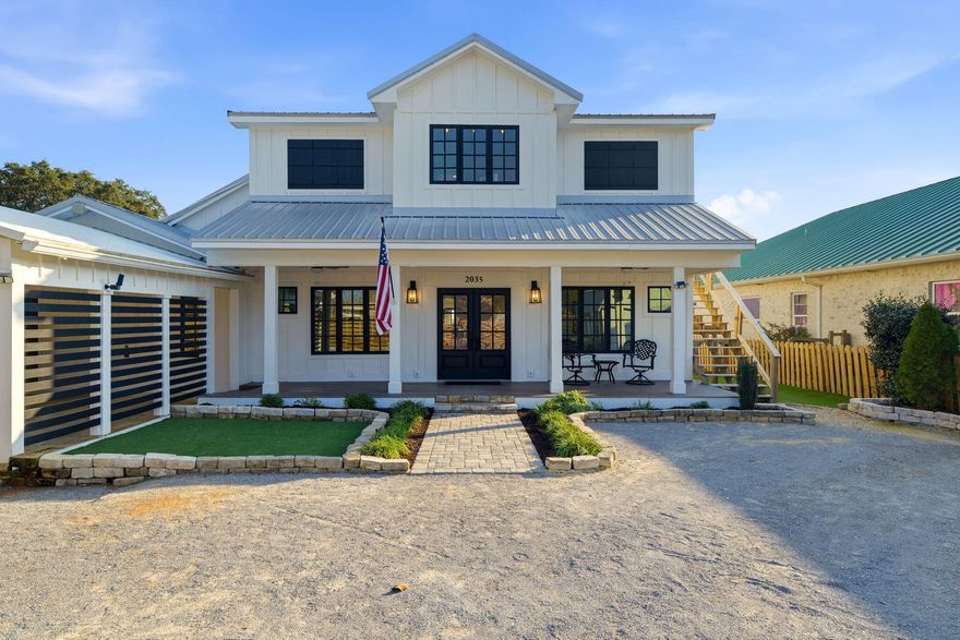 Waterfront Luxury Meets Custom Craftsmanship at 2035 Wind Trace Rd, Navarre FL. Welcome to your private soundfront retreat on the beautiful shores of Navarre! This extraordinary, newly rebuilt coastal home offers 3,500 square feet of custom living space, featuring 4 bedrooms in the main residence plus a fully equipped upstairs guest apartment with separate interior and exterior access—perfect for multi-generational living, guests, or income-producing potential. Perched on nearly half an acre with 75+ feet of waterfront and no HOA, the property features an approximately 300-foot dock with two boat lifts—one of which is covered. Relax in your saltwater pool or entertain in the spacious gazebo while enjoying panoramic views of Santa Rosa Sound. This home has been completely taken down to the studs and remodeled with luxury and efficiency in mind. Highlights include all-new HVAC (including dual Samsung 18 SEER heat pumps and mini-splits), new electrical with 300-amp service, new PEX plumbing, new high-grade cabinets, appliances, LVP flooring, drywall, doors, trim, and sound-insulated walls. The R-2 zoning allows for even greater flexibility, including short-term rental or multi-unit options. This home features 4 individual lockouts. With the final touches left for the buyer to personalize, this is a rare opportunity to own a waterfront masterpiece designed for comfort, style, and coastal living.