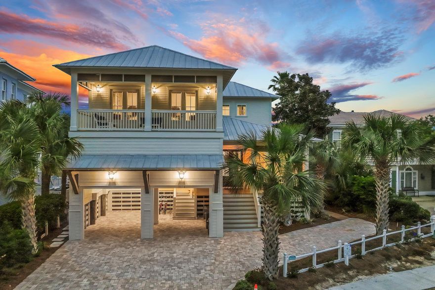 Tucked away in the exclusive, gated community of Destin Pointe, ''Living the Dream'' is a breathtaking lakefront residence offering beautiful glimpses of the Gulf and Destin's East Pass. Designed for both relaxation and entertaining, this exceptional home perfectly blends coastal elegance with modern luxury. Upon entry, you're welcomed into a refined interior featuring solid oak floors, soaring vaulted wood ceilings, and sleek marble countertops. The chef's kitchen is a true centerpiece--ideal for culinary enthusiasts--flowing effortlessly into the expansive living area, creating an inviting space for gatherings and unforgettable moments. Step outside onto the covered balcony, where a cozy fireplace and mounted TV set the stage for year-round enjoyment.
