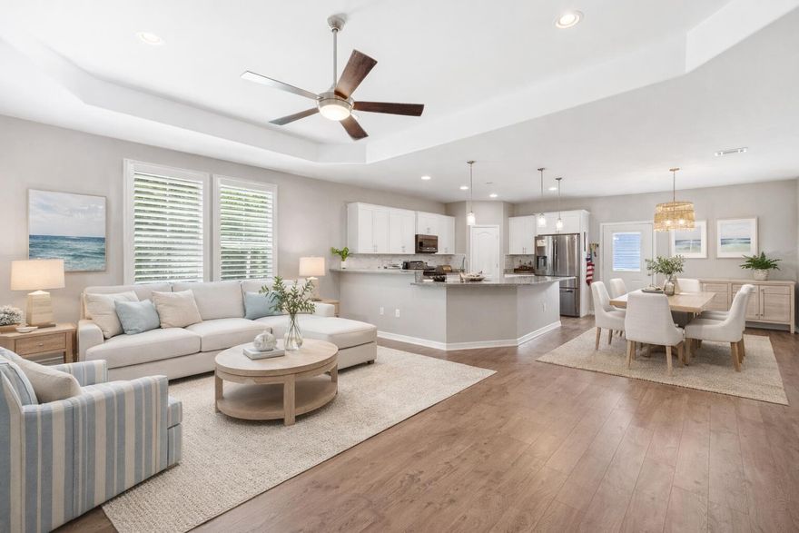 Do you enjoy sitting on your porch and watching the dolphins play?  Look no further - Welcome to this stunning, like-new home in the sought-after bay front community of Pelican Bay—designed with style, space, and flexibility for full-time living or the perfect second home.  This beautifully crafted 5-bedroom, 3-bath residence features a thoughtfully planned layout with a first-floor primary suite, three additional bedrooms and a full bath on the main level, plus a spacious upstairs bedroom with its own full bath—ideal for guests or a private retreat. Enjoy open-concept living and dining areas, a large kitchen with ample cabinetry, a walk-in pantry, and easy flow for entertaining.  Other standout features include an oversized two-car garage, additional parking, and a whole-house generator for added peace of mind. Located in Pelican Bay, a gated, boutique community amenities include a tennis and pickle ball court, bay front park , dock to fish, pull your boat up for loading and unloading, drop in your kayak or paddle board. All of this with LOW HOA fees about a mile to shopping, restaurants and entertainment at Grand Boulevard, as well as the hospital and just minutes to the beach.