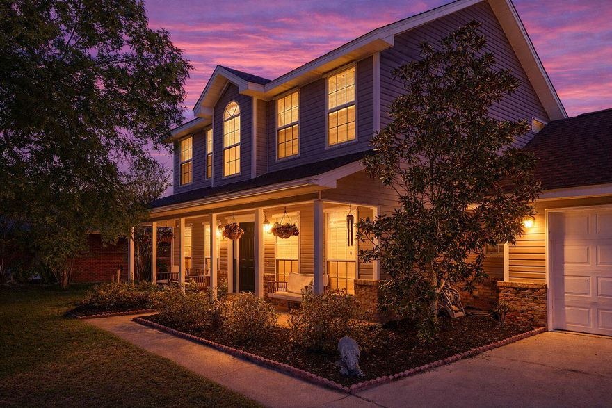 Welcome to Creekwood Court--where mornings begin with lakefront sunrises and evenings wind down by the fire.

Situated on a cul-de-sac in Navarre, this colonial-style home offers a peaceful setting with lake views. Inside, warm finishes create an inviting atmosphere, and the renovated kitchen features quartz countertops, updated cabinetry, stainless steel appliances, and ample workspace.

The two-story layout provides functional living space, anchored by a main living area with a wood-burning fireplace. Large windows allow for natural light and views of the surrounding landscape.

Enjoy the connection to the outdoors with a deck overlooking the lake, offering space for outdoor dining or lounge seating. The backyard includes a firepit and a lush setting that complements the water views, creating additional space to relax or gather. New Windows to be added on April 17th!