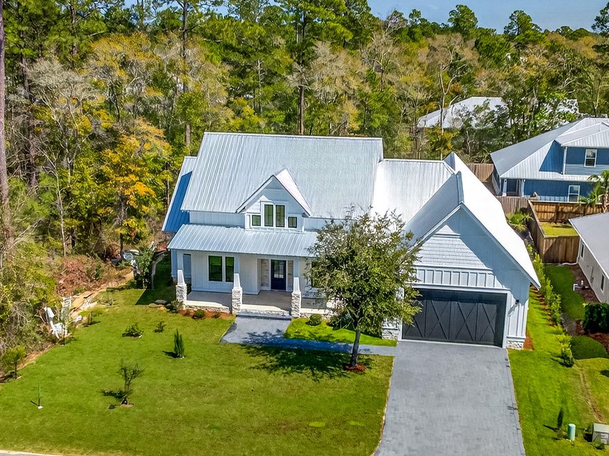 *** New construction tucked away on one of the larger lots in Bear Creek Cottages, just 10 minutes from the beautiful beaches, parks, restaurants, and golf courses of South Walton and 30A.
This stunning 3-bedroom, 3.5-bath home features an open floor plan with 12-foot ceilings and thoughtful, high-end finishes throughout. Highlights include keyless entry,  impact-resistant windows and doors, a durable metal roof, an oversized garage with additional storage, hardwood floors, vaulted ceilings, a cozy fireplace, and the master bath features luxurious soaker tub.
The chef's kitchen is designed for both everyday living and entertaining, complete with KitchenAid appliances, a gas cook top and a convection wall oven.
 The home offers two spacious porches wired for .... ceiling fans The front porch overlooks a charming fountain and manicured lawn, while the rear porch is equipped to mount a 80 inches TV--ideal for outdoor gatherings.
This impressive home is perfect for hosting family and friends while enjoying life in a highly sought-after planned community. Amenities include pickleball, tennis and basketball courts, a children's play area, fitness center, and an Olympic-style pool.
Don't miss this opportunity--BUY NOW ! Additional homes are available in Phase 2, offering options for everyone in this desirable community.