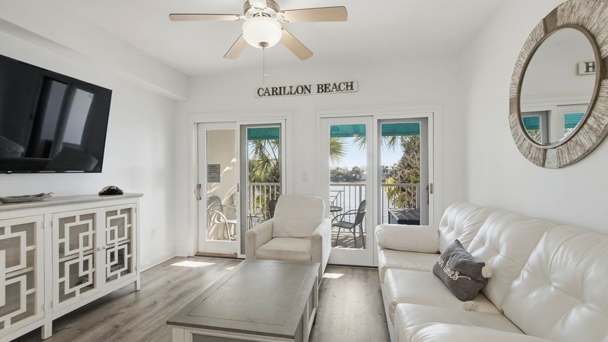 RENOVATED. TURN-KEY. INCOME-READY.
This is the kind of condo buyers wait for--and rarely catch.  Perched on the second floor of Carillon Beach Inn, this fully upgraded unit delivers what most 'updated' listings promise but don't: a true, start-fresh renovation with a clean coastal feel that instantly puts you in vacation mode.  The kitchen? Done right. Granite countertops, a generous breakfast bar for slow mornings or evening cocktails, stainless steel appliances, and updated cabinetry that actually feels current--not 'recently refreshed.'
Luxury vinyl flooring runs throughout, paired with curated coastal furnishings that make this unit not just move-in ready--but rental ready on day one.
And then there's the view.
Step onto your private balcony and you're looking straight out over Lake