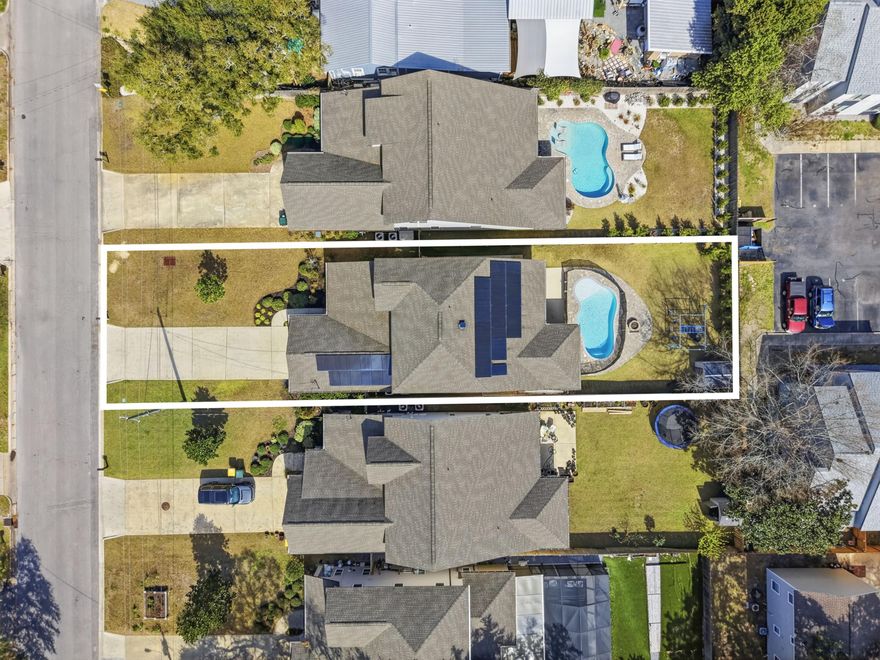 Beaches, boating, local dining, and weekend events--all just minutes from your door. Imagine mornings at the public boat launch, afternoons at the Member Only Ft Walton Yacht Club with its private beach and dining, and evenings unwinding in a neighborhood where golf carts are part of daily life. No HOA, no rental restrictions.

What makes this home truly unique is that it's not a spec build--it was designed specifically for this location. The main floor features the master suite, two additional bedrooms, and a guest bathroom along with the main living areas to include open floor plan and separate dining room. Floors are woodgrain tile throughout with carpet in bedrooms and upstairs. Upstairs, you'll find a fourth bedroom, a full bath, and an entire second living space, offering endless possibilities as a media room, home office, guest retreat, or creative space. 

Outside, your private backyard oasis awaits: a heated gunite pool, fenced yard for privacy, and a removable pool safety gate for peace of mind. Paid-off solar panels provide excellent electric efficiency and long-term savings, adding both value and sustainability.

This home blends modern design, flexible living, and coastal charm, perfectly positioned to enjoy the Emerald Coast lifestyle--whether as a primary residence, vacation escape, or investment opportunity.