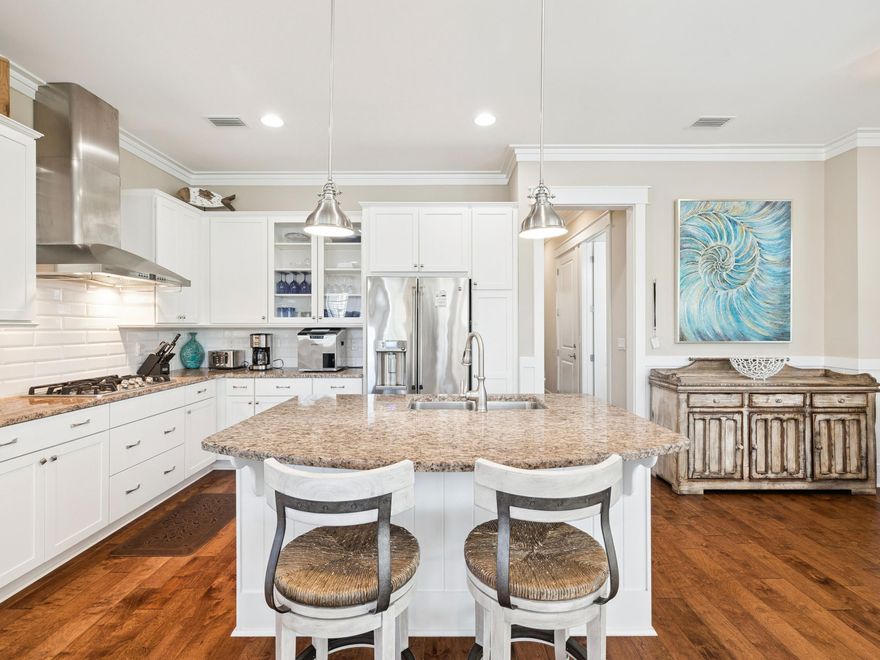Situated on an oversized corner lot within NatureWalk at Seagrove, this exceptional property offers the perfect balance of refined living and coastal lifestyle. It is just a short bike ride from The Gathering Place amenity center and less than a mile from the beach. The bright, open living area features a cozy fireplace and flows seamlessly into a well-appointed kitchen with white shaker cabinetry, granite countertops, subway tile backsplash, and a gas cooktop. The generous dining space is ideal for entertaining large gatherings. The home offers two primary suites, including a main-floor retreat complete with a soaking tub, separate shower, and dual vanities. The upper level features three additional bedrooms, including a custom bunk room, a spacious loft, and a second primary suite with a screened porch overlooking a serene pond. As a resident of NatureWalk at Seagrove, you'll enjoy access to resort-style pools, fitness stations, scenic trails, and a dedicated path to the beach, making this an exceptional opportunity for a full-time residence or a premier vacation home along 30A.