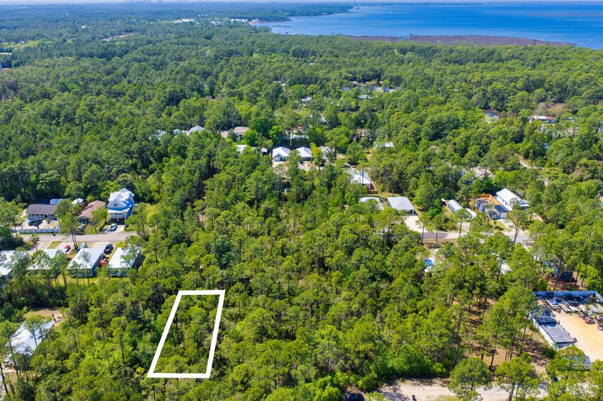 A spacious homesite with mature landscaping that would be ideal for a primary residence, vacation home, or an income-generating property. The property is not subject to homeowners association regulations and does not require a build-out period. It is conveniently located near the Cessna Landing boat launch and the restaurants, shops, and beaches of South Walton.