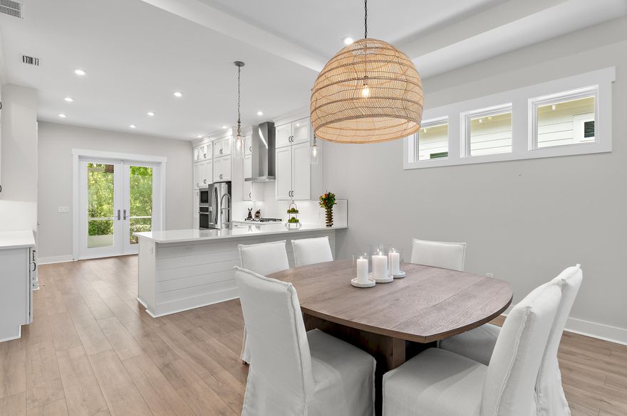 Classic coastal charm defines this thoughtfully designed home, built in 2021 and ideally positioned within the gated NatureWalk community, backing to a peaceful wooded preserve. The popular ''Clearwater'' plan welcomes you with a charming front porch and an inviting open floor plan, where the living and dining areas feature tray ceilings and upgraded shiplap accents for a refined coastal feel. A versatile bonus space just off the main living area--complete with custom barn doors--offers the perfect setting for a home office or den.
The spacious kitchen blends style and function, showcasing white cabinetry with glass-front upper cabinets extending to the ceiling for added storage, stainless steel appliances, a sleek subway tile backsplash, an oversized pantry, and direct access to the screened lanai through double doors--ideal for enjoying cool evenings and tranquil views of the preserve and colorful winter sunsets.
The primary suite is light-filled and airy, featuring tray ceilings, a generously sized walk-in closet, and a well-appointed ensuite bath with an extended vanity and makeup area, along with a large walk-in shower. An additional guest bedroom, full bath, and laundry room complete the home. Notable upgrades include 10' ceilings, Mohawk RevWood flooring, and an oversized screened lanai designed for relaxed outdoor living.
Designed with ease of living in mind, this home is an excellent option for retirees seeking a low-maintenance lifestyle without the burden of a large home, while still enjoying thoughtful design, quality finishes, and comfortable indoor-outdoor living.
Residents of NatureWalk enjoy exclusive amenities including a heated pool, fitness center, two lighted tennis courts, and four lighted pickleball courts. Ownership also includes access to all Watersound Origins amenities, featuring a 9-hole golf course, additional tennis and pickleball courts, basketball, fitness center, clubhouse, resort-style pool, Watersound Town Center, and dock access to Lake Powell for paddle boarding and kayaking. Watersound Origins homeowners are automatically enrolled in Watersound Membership, with the option to upgrade to Watersound Club for access to the Watersound Beach Club, Camp Creek Golf Club, and private member events. Another perk is the newly opened Sidecamp Path which creates a convenient LSV-only connection from Watersound Origins to Shark's Tooth--transforming access to golf, dining, and Club amenities into an easy cart ride from your doorstep. 

Long-term rentals are allowed offering flexibility for use as a primary residence, second home, or investment opportunity. A rare balance of accessibility and tranquility just minutes from 30A's dining and beaches, this home is comfortably removed from the bustle.

Measurements are approximate.  Buyer to verify all data and dimensions if important.