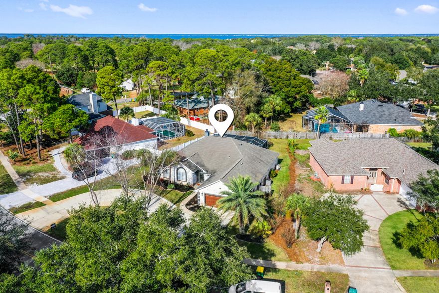 Located in the established Indian Bayou neighborhood, known for its quiet streets, mature landscaping, and strong sense of community, this single-story residence sits on a .33-acre lot. The layout is functional and well balanced, featuring high ceilings and open living areas suited for everyday living and entertaining. The main living space opens to a screened-in pool and covered lanai, creating an easy indoor-outdoor connection and a private outdoor setting. Additional highlights include updated custom closets, a two-car garage, gas connections, a tankless water heater, and updated systems. The spacious lot offers room to enjoy outdoor living while maintaining privacy and a comfortable sense of separation from neighboring homes.