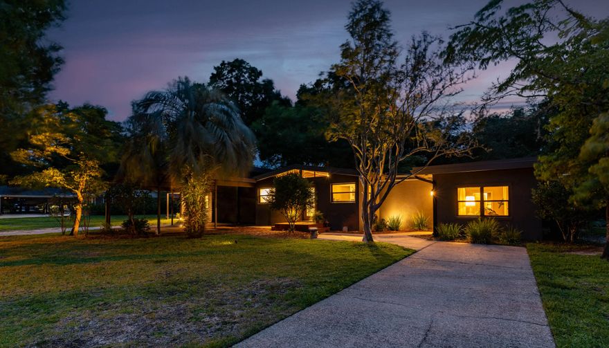 MOTIVATED SELLERS! Large home, large lot, with separate studio apartment! Come home to comfortable, modern living just minutes from the beautiful, emerald waters of the Gulf Coast. This 2,178 sq/ft home showcases preserved mid-century charm with its original knotty-pine ceilings, authentic terrazzo floors, and updated amenities in every room including a full kitchen remodel in 2022. The most exciting update is the 879 sq/ft addition completed in 2019. Equipped with a full bathroom, walk in closet, vaulted ceilings, and huge living space, this addition would be a great space as a mother-in-law suite, entertainment and game room, guest apartment, or potential income opportunity! Plumbing is already available in the wall for a kitchenette. Seller is offering to provide $10,000 to assist in closing costs, rate buy-down, or future projects to help the next home-owner get started! Call your agent today for a private showing. ROOF 2021, TANKLESS WATER HEATER 2015, RE-PLUMBED 2018, Newer HVAC systems