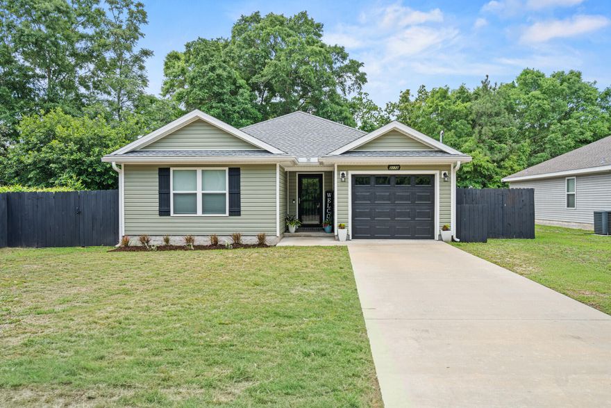Move-in ready and better than new. This well-maintained one-owner 3-bedroom, 2-bath home offers quality construction, thoughtful design, and upgrades already in place. Built in 2022, the home still feels fresh, clean, and ready for its next owner.Situated on approximately 0.40 acres with no HOA, the property offers space, privacy, and flexibility. The large fenced backyard, covered back porch, and extended patio provide an ideal setting for relaxing or entertaining. Two storage buildings add convenience for tools and equipment.Inside, the split-bedroom floor plan provides privacy, with the primary suite located at the back of the home. Vaulted ceilings in the living room create an open feel. Luxury vinyl plank flooring runs through the main areas, with carpet in bedrooms. The kitchen includes stainless appliances, a breakfast nook, and soft-close cabinetry. Washer and dryer included.