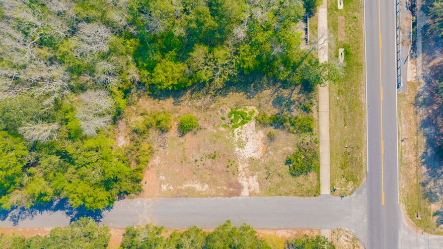 Nestled on a mostly cleared corner lot in a peaceful cul-de-sac just off the beautiful East Bay, this property offers an ideal setting to build your dream home. With public water and electricity already in place, it's ready for construction to begin. Conveniently located near Navarre Beach, you'll enjoy quick access to sun, sand, and coastal living. Plus, you're just a short drive from local restaurants, shopping, and schools, giving you both tranquility and everyday convenience.