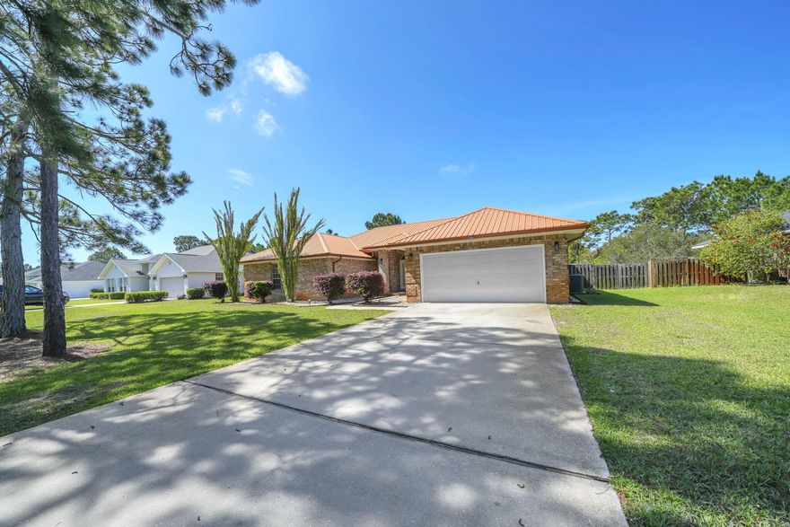 Perfectly nestled home on an extra large homesite with expansive view of the lake and enormous backyard! This home is situated on over half an acre in Driftwood Estates. This home has been beautifully updated throughout. The interior of the home offers an open concept with four bedrooms, stainless steel appliances, solid surface countertops, tile throughout main living areas, and custom master tile shower/bathroom. The exterior provides custom hurricane shutters, a two-car garage, fenced in backyard, a screened in porch for outdoor activities, expansive lake views and plenty of yardage to absorb the tranquility of the neighborhood. Not to mention, the metal roof! This home awaits you and your family! Call today to make 641 E Shipwreck your new Santa Rosa Beach home today!