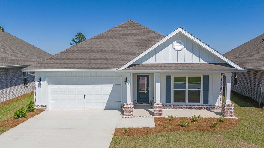 Welcome to 31 Gray Owl Drive, a new home located at Owl's Head Farms, in Freeport, Florida. Step inside to a welcoming and open layout designed for comfortable living. The kitchen, complete with quartz countertops, Whirlpool stainless steel appliances, undermount single basin sink with a dedicated water filter faucet and a functional island, opens directly to the dining area and living room, creating a seamless space for entertaining and relaxation. The high 9' ceilings and additional tray ceilings in the living and primary bedroom create boosts the luxurious feel in this home. The owner's suite, tucked away at the back of the home, features a private bathroom with a walk-in shower and double vanity.