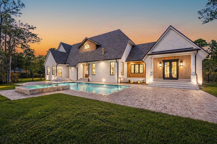 Brand new and fully complete, 159 Seclusion Way is a refined new-construction estate set on the final one-acre homesite (Lot 48) within the gated bayfront community of Seclusion Bay. This thoughtfully designed residence spans 4,872 square feet and offers five bedrooms, five and one-half bathrooms, and a three-car garage, all curated with elevated finishes and intentional architectural detail. Outdoor living takes center stage with a 17×34 resort-style pool, an 8×8 spa, and a fully equipped outdoor kitchen--creating a private coastal retreat ideal for entertaining and year-round enjoyment. Inside, expansive living spaces are defined by clean lines, warm textures, generous ceiling heights, and abundant natural light throughout. Seclusion Bay is one of Santa Rosa Beach's most sought-after hidden enclaves, known for its low-density setting, oversized homesites, and exclusive access to a private community dock on the Choctawhatchee Bay. Residents enjoy a rare blend of privacy and convenience, just minutes from the sugar-white beaches of 30A, premier dining, boutique shopping, championship golf, and the lifestyle offerings of Miramar Beach and Destin.

Whether envisioned as a primary residence, second home, or long-term investment, 159 Seclusion Way delivers a compelling combination of craftsmanship, scale, and coastal elegance. With the home now complete and entering Coming Soon status, this represents a rare opportunity to secure a newly finished estate in one of Santa Rosa Beach's most exclusive bayfront communities.