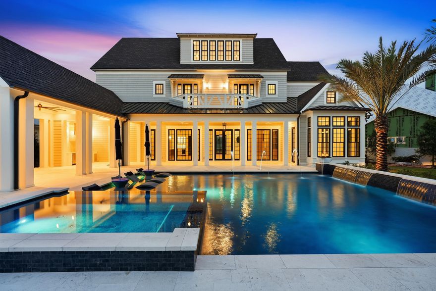 At 107 Quail Hollow Court in WaterSound Camp Creek, outdoor living takes center stage. Designed with entertaining in mind, the home's outdoor spaces extend seamlessly beyond the interior, opening to a backyard that feels both expansive and intentional. A heated saltwater pool with elegant fire bowls commands attention, offering a resort-caliber setting that invites you to slow down and stay awhile.
 The scale of the outdoor environment is what truly distinguishes this residence. The pool terrace gives way to a remarkably generous yard, creating a sense of openness rarely experienced in WaterSound Camp Creek. There is space to host, to play, to unwind, and to simply enjoy the luxury of having room to breathe. Whether it is a lively evening gathering or a quiet morning with coffee in hand, the setting adapts effortlessly to the rhythm of life.

A fully equipped outdoor kitchen and fireplace complete the experience, allowing days to transition naturally into evenings spent beneath the coastal sky, where every detail has been designed for comfort, connection, and elevated living. One of the defining advantages of Camp Creek living is the inclusion of a WaterSound Beach Club membership, offering access to Gulf-front amenities that further extend the lifestyle beyond the home.

Inside, the home continues to impress with a thoughtful balance of scale, comfort, and refined design. Spanning 7,474 square feet across three levels, the residence offers six bedrooms, seven full bathrooms, and three half baths, along with a three-car garage. Warm hardwood floors, coffered ceilings, and carefully considered proportions create interiors that feel expansive yet welcoming from the moment you enter.

At the heart of the home, the kitchen is designed to support both everyday living and elevated entertaining. Custom cabinetry, Sub-Zero appliances, a generous walk-in pantry, and a dedicated scullery allow the space to remain polished while accommodating gatherings of any size. Nearby, a curated wine cellar offers a refined setting for collection and display, while the adjoining living area, anchored by a fireplace and custom built-ins, provides a natural place to gather, unwind, and connect.

Upstairs, the home unfolds with spaces designed for both recreation and retreat. A dedicated game room or bunk room offers a lively setting for gathering, while the third-floor movie room with wet bar provides a more private environment for film nights, celebrations, or relaxed evenings at home.

Throughout the residence, each space has been designed with intention, balancing elegance with livability. With its generous scale, curated finishes, and exceptional indoor and outdoor living, 107 Quail Hollow Court presents a home where everyday moments feel elevated and the coastal lifestyle is experienced at its fullest.