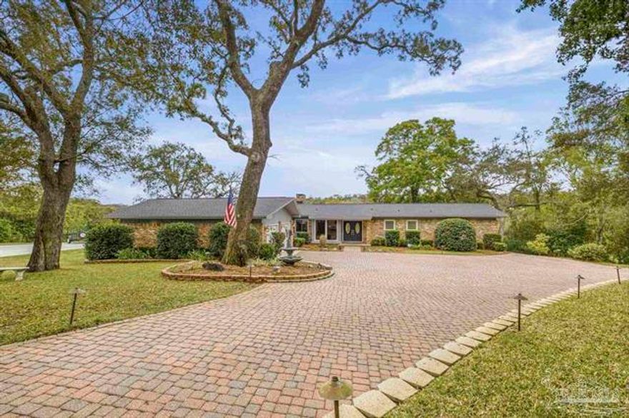 Discover this exceptional waterfront estate offering space, privacy, and direct Gulf access. Situated on two parcels, 7 Krivik Ct and 8 Krivik Ct, totaling 1.82 acres, this gated property delivers a refined coastal lifestyle with an impressive paver driveway and timeless craftsmanship throughout.

The thoughtfully designed floor plan features 4 bedrooms, multiple spacious living areas, and a versatile bonus room perfect for entertaining, relaxing, or extended living needs. Outside, enjoy a screened-in pool, fully equipped outdoor kitchen, and peaceful natural surroundings highlighted by two freshwater springs.

At the water's edge, the private dock includes two boat lifts, a jet ski lift, and a fish cleaning station, providing easy Gulf access for boating, fishing, and watching dolphins play.

Additional features include a 2-car attached garage plus a detached 2-car garage with flexible second-floor space ideal for a studio, workspace, or guest area. A whole-house generator services both parcels for year-round comfort and reliability.

With updated HVAC systems and water heaters installed in 2015 and a 2026 roof, this rare waterfront property combines quality, functionality, and an unbeatable lifestyle opportunity. Call today to schedule your private tour.