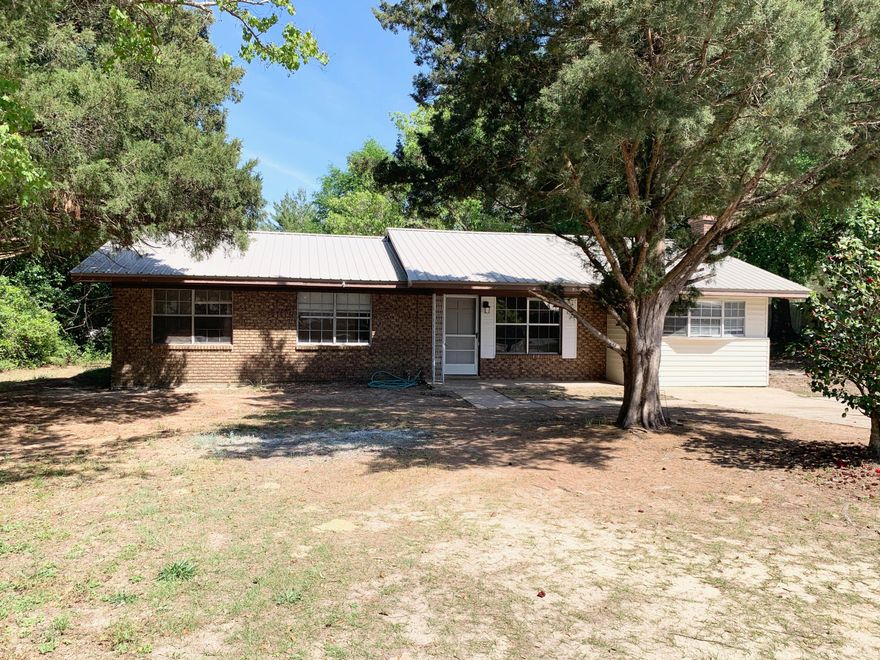 Discover the Best Small Town in Florida!

Experience the perfect blend of historic charm and modern convenience in this highly desired location. Situated on Juniper Lake Road, this property puts you in the heart of DeFuniak Springs, voted ''Best Small Town in Florida.'' Whether you are looking for a peaceful primary residence or a savvy investment, this location offers a lifestyle of recreation and relaxation.

The lot will be divided at closing. HOWEVER, for an additional $20,000, you can secure the entire lot! Keep the extra space for a massive backyard or hold it as an investment.

Prime Location: Just minutes from Walton High School and the vibrant downtown district.

Buyer to verify all dimensions and pertinent information. Coastal & Spring Access: Enjoy the best of both worlds. You are a short drive from the sugar white sands of the Emerald Coast and just moments away from the crystal clear waters of Ponce De Leon Springs, the ultimate way to cool off on warm summer days.

Community & Lifestyle
Living here means being part of a community rich in history and natural beauty, including: Lake DeFuniak: Take a stroll around one of the world's almost perfectly circular lakes, featuring a scenic one mile perimeter path; Festivals & Culture: The downtown area and Lake DeFuniak serve as the hub for local festivals, farmer's markets, and holiday events; and an Outdoor Paradise: From lake life to beach days and natural spring hopping, your weekends are officially set.