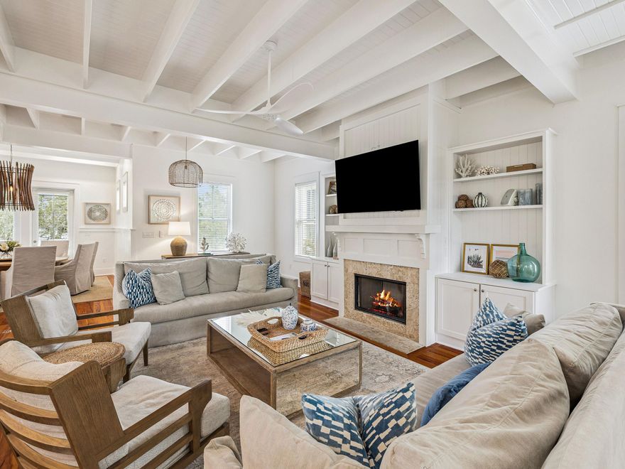 Positioned on a private corner lot within WaterColor Phase I, 90 Silver Laurel Way blends the timeless character of classic Florida cottage architecture with the comfort of refined coastal living. Surrounded by mature greenery and located just two blocks from the sugar-white sands, the home is also within close proximity to the WaterColor Beach Club, Boathouse, scenic trails, and community amenities. Designed for effortless indoor-outdoor living, the residence features four spacious porches, including screened and open-air spaces ideal for relaxing or entertaining. A paved backyard terrace offers additional gathering space with room for a future pool pending approval, all framed by a lush, private setting.
Spanning approximately 3,316 square feet across three levels, the home offers five bedrooms and five bathrooms, including two primary suites--one on the main level and another on the third floor with Gulf views. Rich hardwood flooring, vaulted ceilings with exposed beams, recessed lighting, and a soft coastal palette define the interiors.

The open-concept living area flows seamlessly into the dining space and kitchen, appointed with quartz countertops, premium stainless steel appliances, and a Sub-Zero refrigerator. A gas fireplace with custom built-ins anchors the living room, while an adjoining bar area and breakfast nook enhance the home's inviting atmosphere.

Additional highlights include updated bathrooms, surround sound, multiple owner storage closets, covered parking, and an extended paved driveway. Residents of WaterColor enjoy access to resort-style pools, tennis courts, fitness amenities, Camp WaterColor, dining venues, and scenic walking trails, with Seaside just moments away.

Offering privacy, thoughtful design, and a prime location near the Gulf, 90 Silver Laurel Way presents a timeless coastal retreat within one of 30A's most sought-after communities.