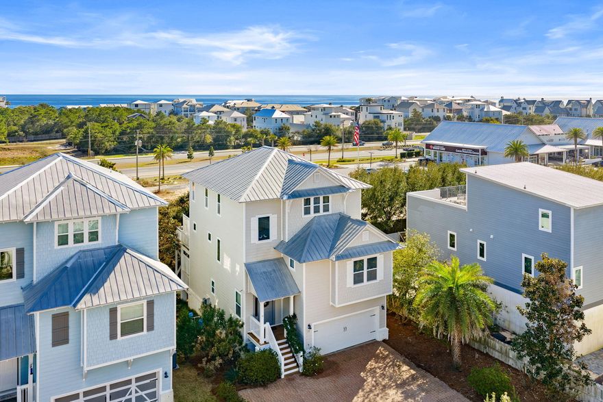 Tucked away in the sought-after Inlet Heights community of Inlet Beach, this beautifully appointed 3-story, 4 bedroom coastal retreat offers the perfect blend of luxury, location, and lifestyle. Just a short distance from the sugar-white sands of the Gulf, this home is ideally positioned for enjoying everything along Scenic Highway 30A.

Designed for both relaxation and entertaining, the home features multiple levels of decks and a private fire pit area, perfect for gathering with friends and family after a day at the beach. From the third-story balcony, enjoy stunning water views of the Gulf, creating the ideal setting for morning coffee or sunset evenings. Inside, the thoughtfully designed layout offers hardwood floors throughout the main living areas, a spacious great room, and an open dining area that flows seamlessly for entertaining.

The first level includes two guest bedrooms and a laundry room, offering privacy and convenience for guests. The second floor features an additional bedroom and full bath, while the third floor is dedicated to an oversized primary suite complete with an office nook, his-and-her vanities, a large soaking tub, and a beautifully tiled walk-in shower.

Additional highlights include a 2-car garage, paver roads and driveways, and the home is being sold fully furnished, making it truly move-in or rental ready.

Residents of Inlet Heights enjoy exceptional amenities including a community pool, community room, and a dock overlooking Lake Powell. The location also allows for an easy walk or bike ride to 30Avenue, Rosemary Beach, and nearby public beach access, placing dining, shopping, and the beach all within reach.