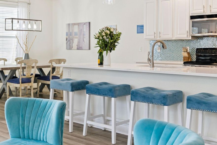 Welcome to your turnkey coastal retreat in the highly sought-after gated community of Villages of Crystal Beach, perfectly located in the heart of Destin. This beautifully updated six-bedroom, four-bath home sits on a sun-filled southeast-facing extra-large corner lot directly across from the entrance to Destin's largest 30,000-sq.-ft. Tahitian-style lagoon pool, delivering true resort-style living just steps from your front door. 

Recent upgrades include BRAND NEW A/C, NEW EXTERIOR PAINT, a new LG refrigerator, two new smart electric water heaters, new smart thermostats, and a new smart keyless entry system. The main-floor furniture and decor have been thoughtfully refreshed, and all six bedrooms feature smart TVs. The home showcases durable luxury water-resistant vinyl plank flooring throughout, complemented by exquisite new tile work in the kitchen and baths, and fresh interior paint.

Hurricane-rated shutters with rolling door guards provide added comfort and peace of mind. Step outside to a freshly painted covered deck space overlooking the lagoon pool, perfect for morning coffee or evening gatherings. The home is surrounded by lush tropical landscaping highlighted by nine iconic palm trees and includes a new barbecue and patio furniture for outdoor entertaining. 

Offered fully furnished and turnkey, including linens and towels, this property is ready to serve as a high-income short-term rental, an effortless second home, or a full-time coastal residence.

Enjoy an easy five-minute walk to the sugar-white sands of the gulf or take advantage of the community's seasonal complimentary beach trolley service. Villages of Crystal Beach offers gated entry with 24-hour security and one of the lowest HOA dues in Destin, which includes landscaping. Whether you're seeking a strong investment opportunity, a beachside getaway, or a full-time residence near the gulf, this exceptional property delivers location, upgrades, security, and resort amenities -- all within walking distance to the beach and Destin Commons.