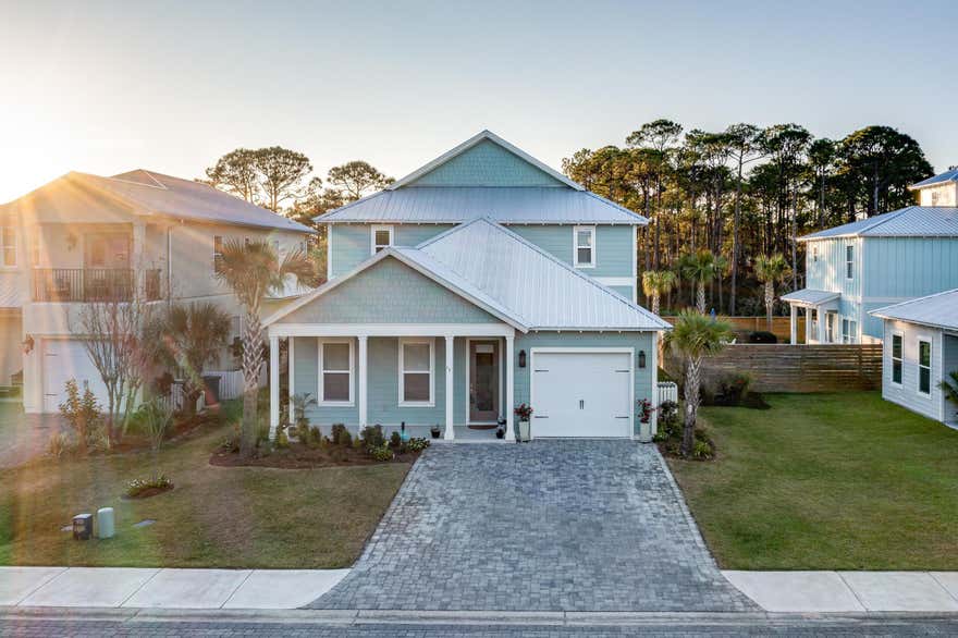 This upscale luxury beach home in Frangista Beach is one of the few properties offering space for a private backyard pool, a rare and valuable feature. Ideal for full-time living or a high performing rental investment, this gated community includes a community pool and is just a short walk or golf-cart ride to the beach and dining. Natural light fills this 4-bedroom, 4.5-bath home, designed for effortless entertaining. Each bedroom is a private suite with its own bath and walk-in closet highly desirable for vacationers. Features include 10' ceilings, upgraded wood vinyl flooring (no carpet), a large kitchen with soft close cabinetry, a massive granite island, smart home controls, oversized garage, custom blinds, and premium outdoor finishes. A must see Frangista Beach opportunity.