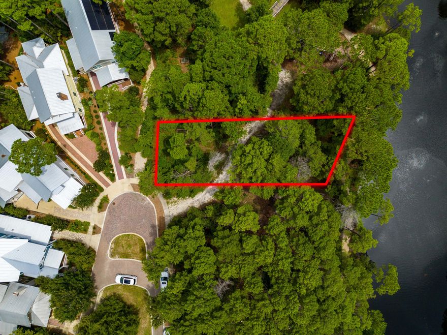 Rare Waterfront Lot for Sale in Forest Lakes | Build Your Dream Home on 30A, Florida.

Opportunity knocks -- and it's sitting on the water. This is the lowest-priced waterfront lot in Forest Lakes, a coveted gated community in Santa Rosa Beach, FL, offering one of the last chances to build your custom dream home with forever lake views from a quiet cul-de-sac setting near Scenic Highway 30A.

If you've been searching for waterfront lots for sale near 30A or the perfect buildable homesite in South Walton, this is the one worth stopping for.

Imagine waking up every morning to the peaceful shimmer of the lake, surrounded by towering native pines and sprawling live oaks -- this is the kind of backdrop that simply can't be manufactured. Forest Lakes is one of 30A's most unique and serene gated communities near Santa Rosa Beach, where nature takes center stage, and neighbors become friends.

A Community Built Around the Good Life

Forest Lakes isn't just a neighborhood -- it's a lifestyle. Spend your days exploring multi-use trails that wind through the natural landscape, casting a line off the picturesque bridge and dock with catch & release fishing, or letting the kids loose at the playground. When it's time to gather, the community pavilion delivers in a big way -- complete with an outdoor grill, sink, generous dining area, and a cozy outdoor living space anchored by a fireplace. All of it looks out over a stunning 2-tiered resort-style pool and lush green lawn. It's resort-style living near 30A without the resort price tag.

A Location That Speaks for Itself

Bordering the pristine Point Washington State Forest and just a short drive to Scenic Highway 30A, you're perfectly positioned to enjoy everything the Emerald Coast has to offer:
Sugar-white sand beaches & emerald Gulf waters
Acclaimed dining, boutique shopping & live music on 30A
Art galleries & entertainment at Gulf Place
Miles of hiking & biking in Point Washington State Forest
Blue Mountain Beach, Santa Rosa Beach & the greater 30A corridor

Why This Lot Stands Out

Lots like this -- waterfront, cul-de-sac, in a gated community this close to 30A -- are genuinely rare in today's market. Whether you're designing your forever home on 30A, a private Florida beach retreat, or a legacy property for your family, this is the canvas you've been waiting for.
Homes and lots in Forest Lakes near 30A rarely come to market at this price. Don't miss your chance to own a piece of one of South Walton's best-kept secrets.

Forest Lakes | Santa Rosa Beach, FL 32459 | Minutes from Scenic Highway 30A & Gulf Place