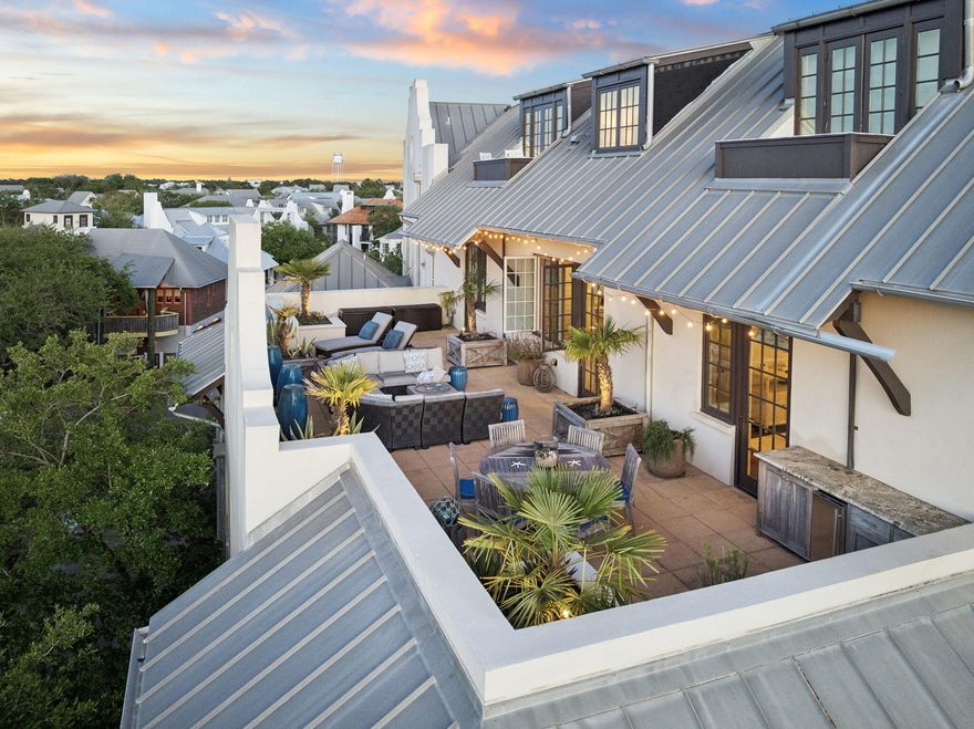 This 3-bedroom, 2-bath condo offers a rare combination of indoor comfort and exceptional outdoor living in the heart of Rosemary Beach's Town Center. Upon entry, the expansive 875 sq ft private terrace immediately stands out--perfect for relaxing, dining under the stars, or entertaining.

Inside, the open living, dining, and kitchen areas feature wood flooring and a well-appointed kitchen with Viking appliances, including a gas range, stone countertops, and generous storage. The primary suite includes a private en-suite bath and direct access to the terrace, creating a seamless connection between indoor and outdoor spaces. Two additional bedrooms share a spacious bath. Additional highlights include underground parking with a dedicated space and a private storage cage, ideal for bikes and beach gear. Located just steps from Town Center shops and restaurants, this residence also enjoys convenient access to the private community beach, four community pools, and the Owners' Pool and Pavilion.