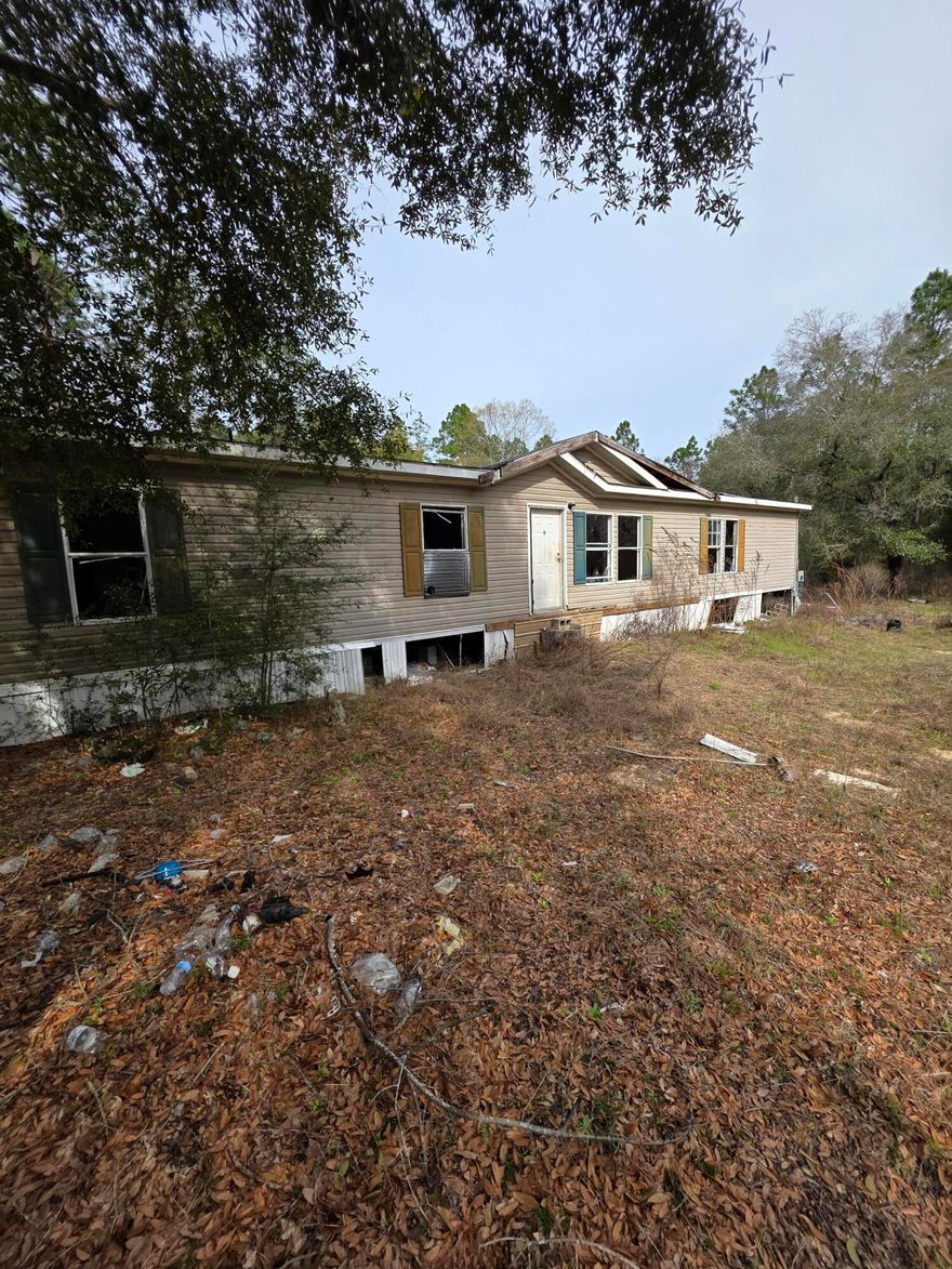 Excellent investment opportunity. 2009 Manufactured Home on 2 acres. Over 2100 sqft 5 bedroom 3 bath. Needs renovation but priced to give plenty of room. Peaceful and private location. Cash only.