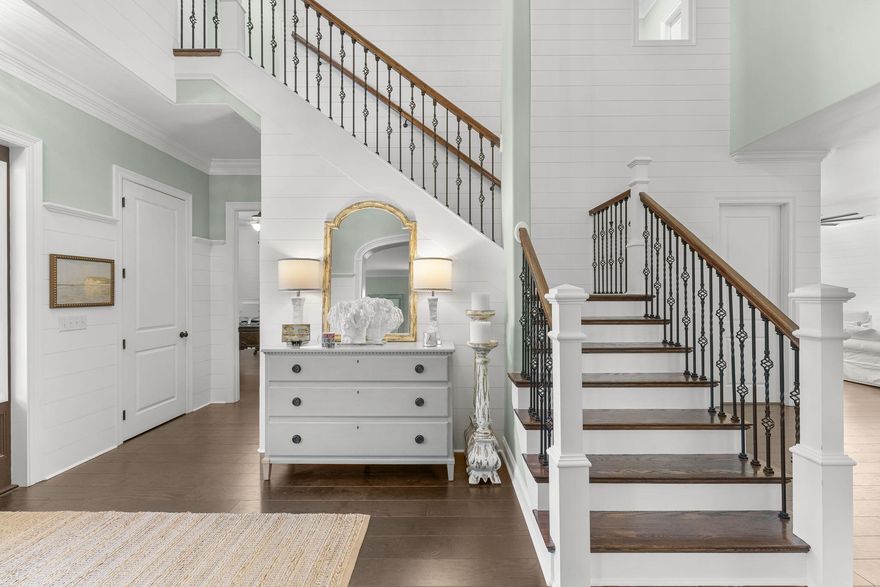 Welcome to this beautifully remodeled and redecorated two-story home that perfectly blends elegance, comfort, and coastal charm. From the moment you step into the grand foyer with soaring 20-foot ceilings, you'll be greeted by light-filled spaces, refined details, and a warm, inviting atmosphere.

This home features two fireplaces, extensive shiplap throughout, with crown molding, new ceiling fans, new LED lighting, and elegant chandeliers that elevate each room. The interior and exterior have been freshly painted, new tile in various rooms, a stylish kitchen backsplash, oversized island and a remodeled guest bathroom. A custom-built book nook adds a unique touch of character and charm, overlooking views of the bay.

The kitchen is an entertainer's dream with a  wet bar, wine fridge