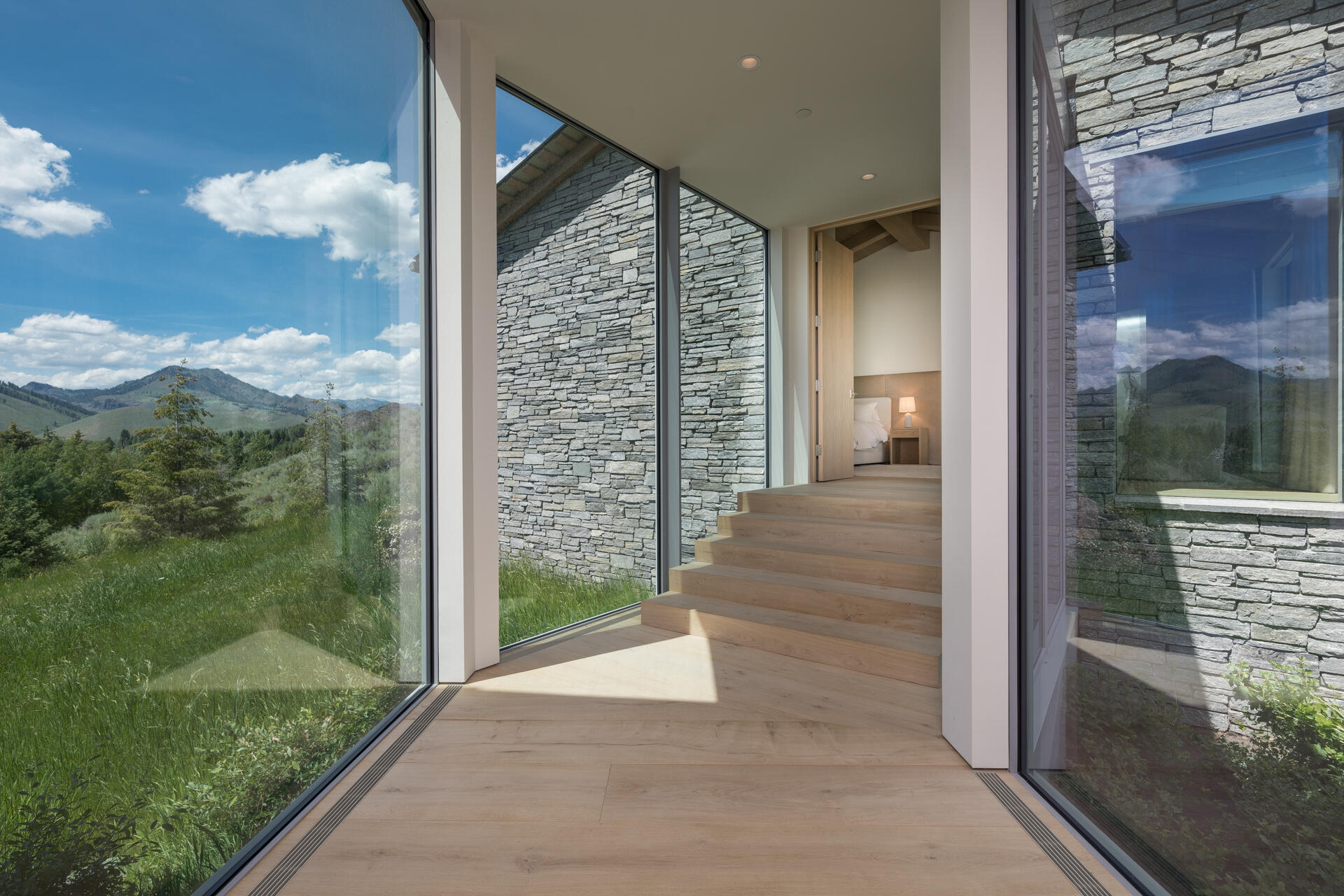 Glass hallway to Primary Bedroom