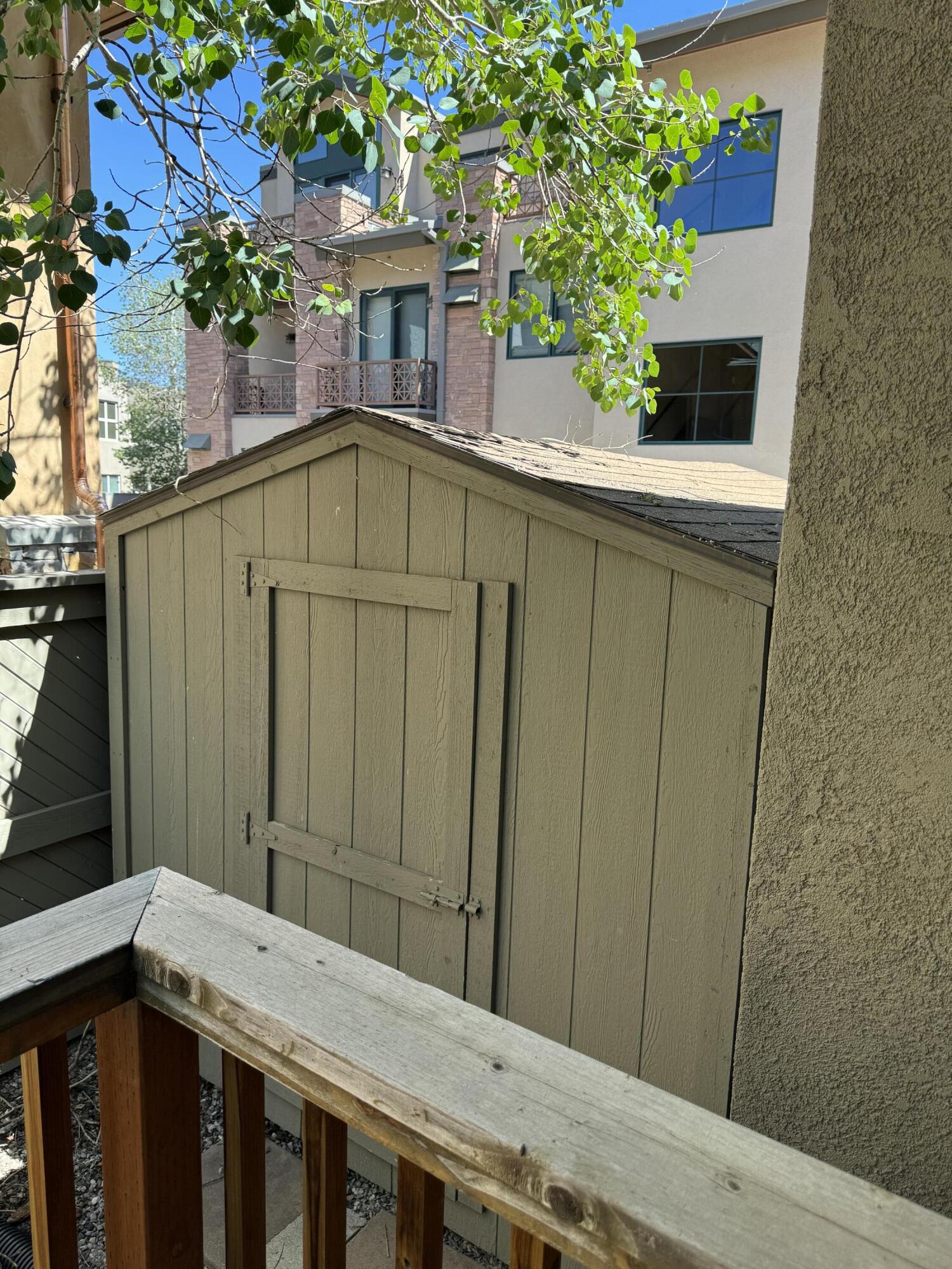 Shed in side yard of home