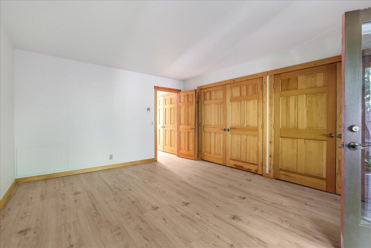 Primary bedroom with 2 sets of closets