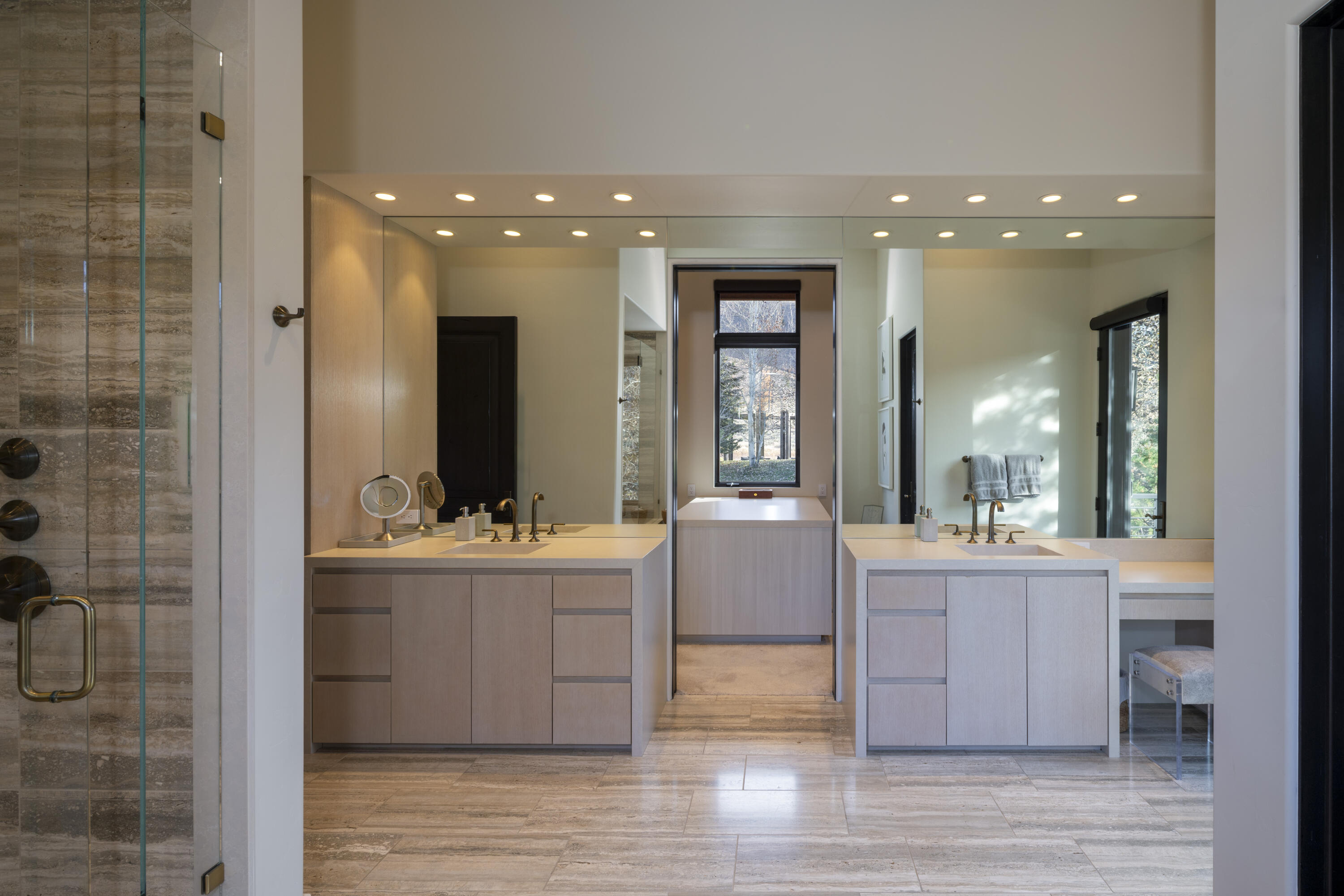 Primary vanities open to large walk in