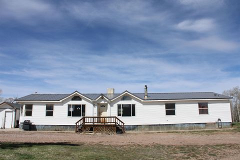 Photo of 12699 State Highway 410, Robertson, WY 82944 (MLS # 20262390)