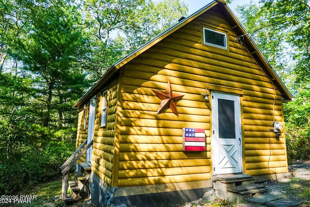 Photo of 223 Five Mile Meadow Road, Dingmans Ferry, PA 18328 (MLS # PW260993)